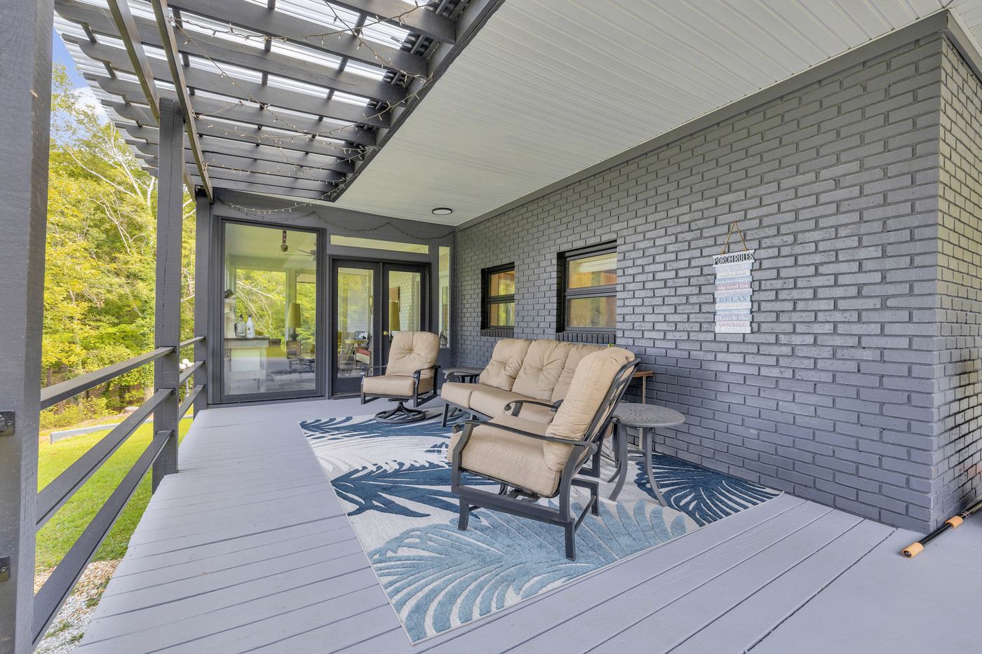 The covered porch outside the sunroom